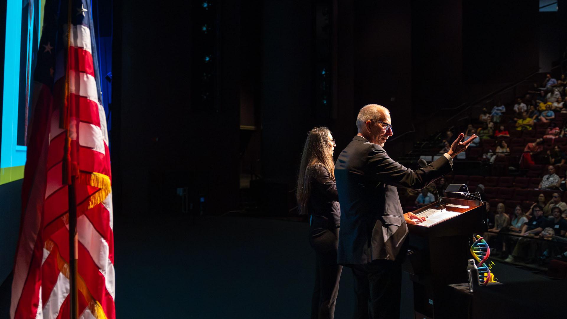 Incoming President Andrew Jones and ASL interpreter at 2025 Convocation