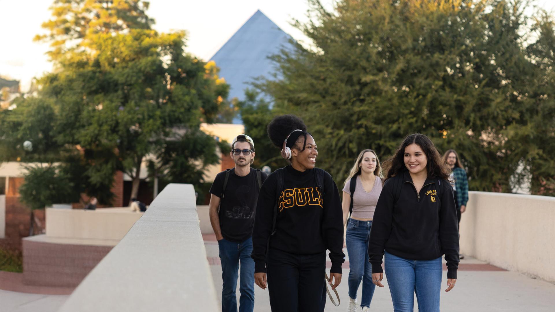 Students walking on the bridge, center of campus