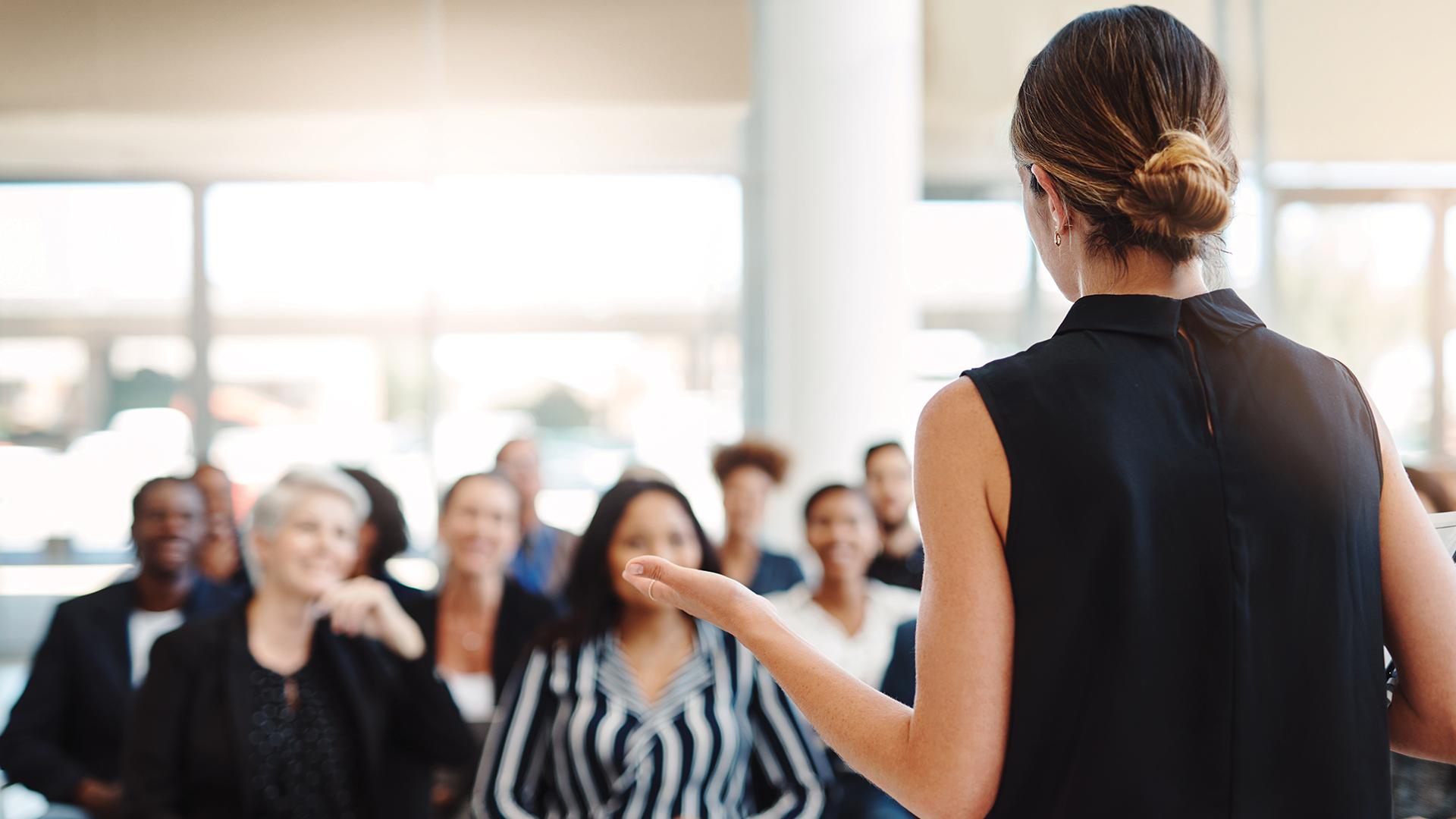 A woman speaking to an audience