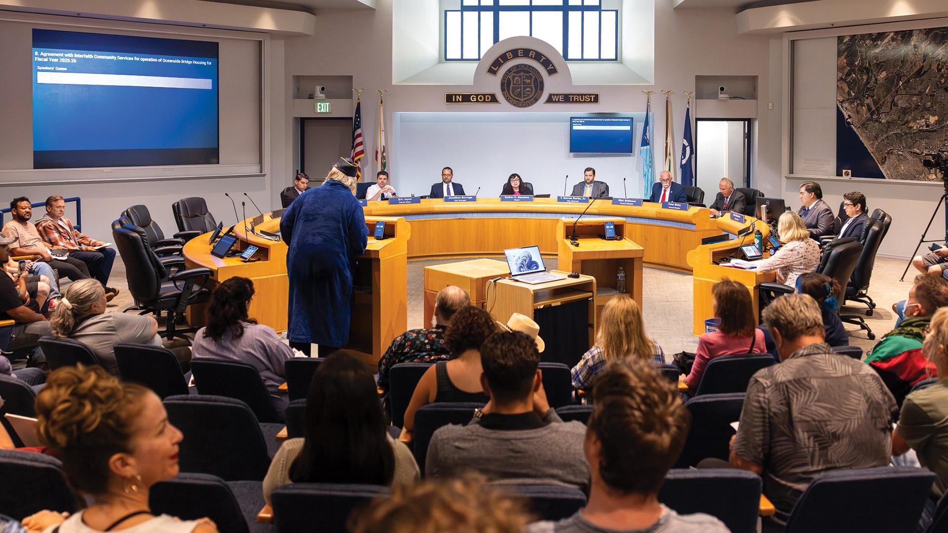 A person speaks during a City Council meeting