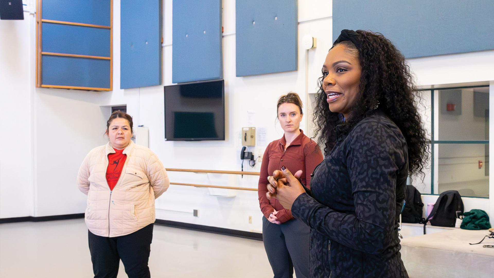 Zakiya Atkinson, right, leads a dance class at CSULB
