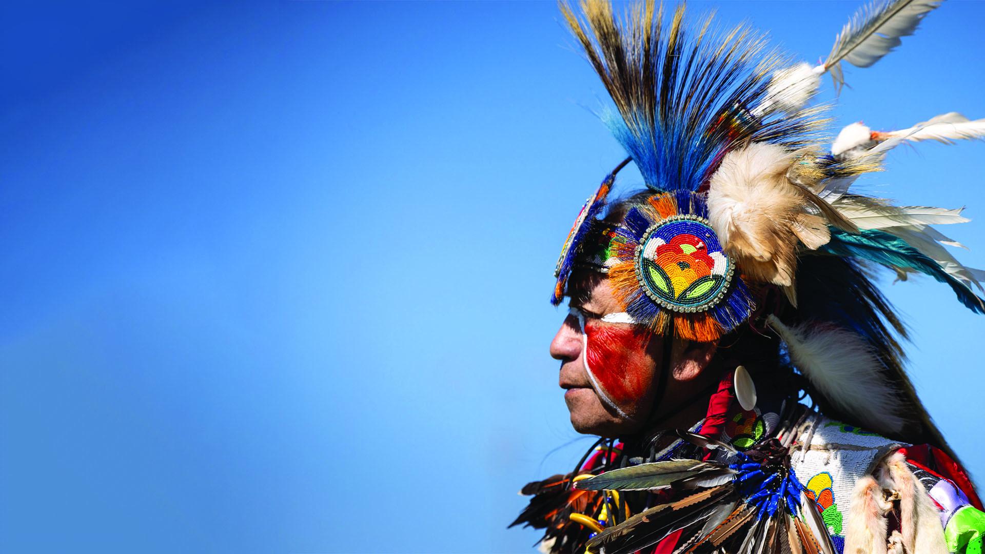 A person wearing a Native American headdress