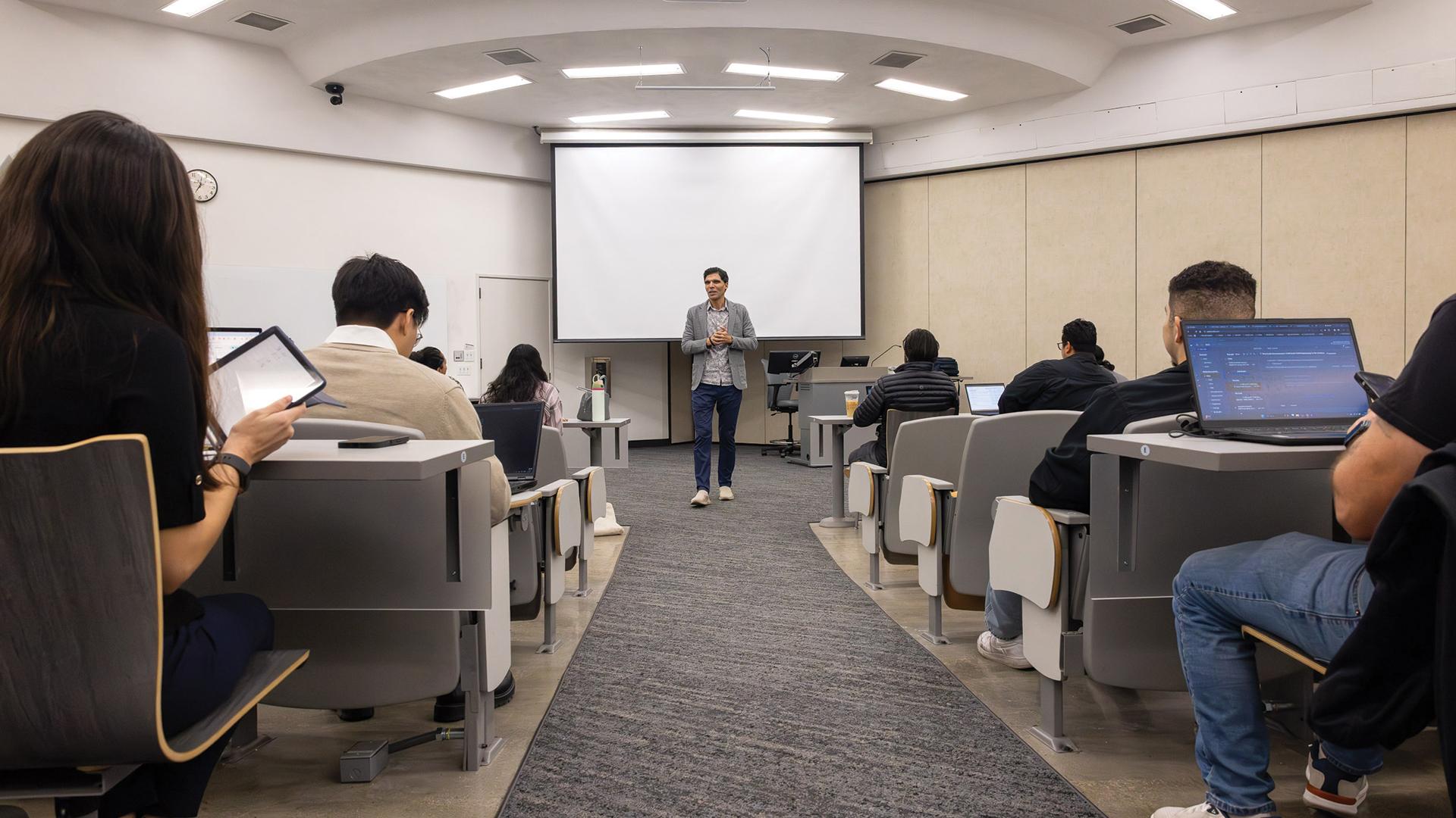 CSULB faculty member Mohamed Abdelhamid with students in a classroom