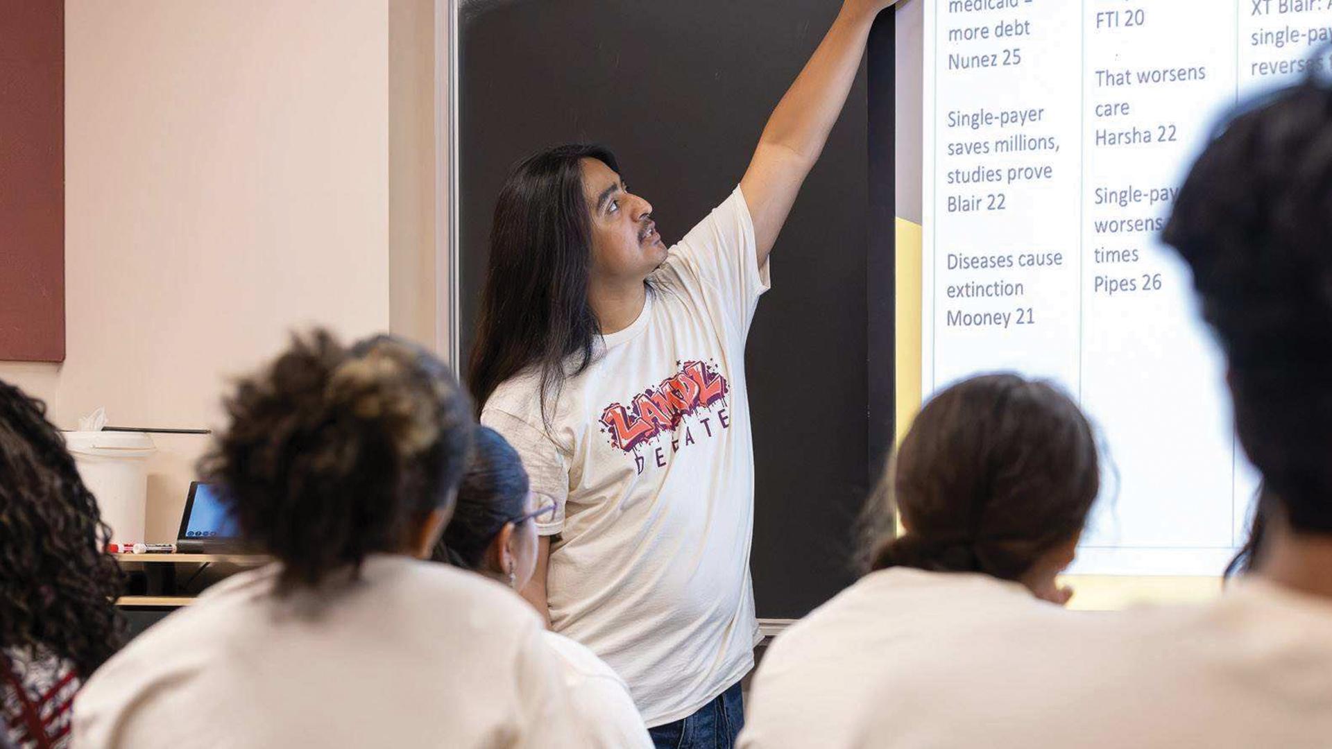 CSULB student Daniel Medina teaching debate