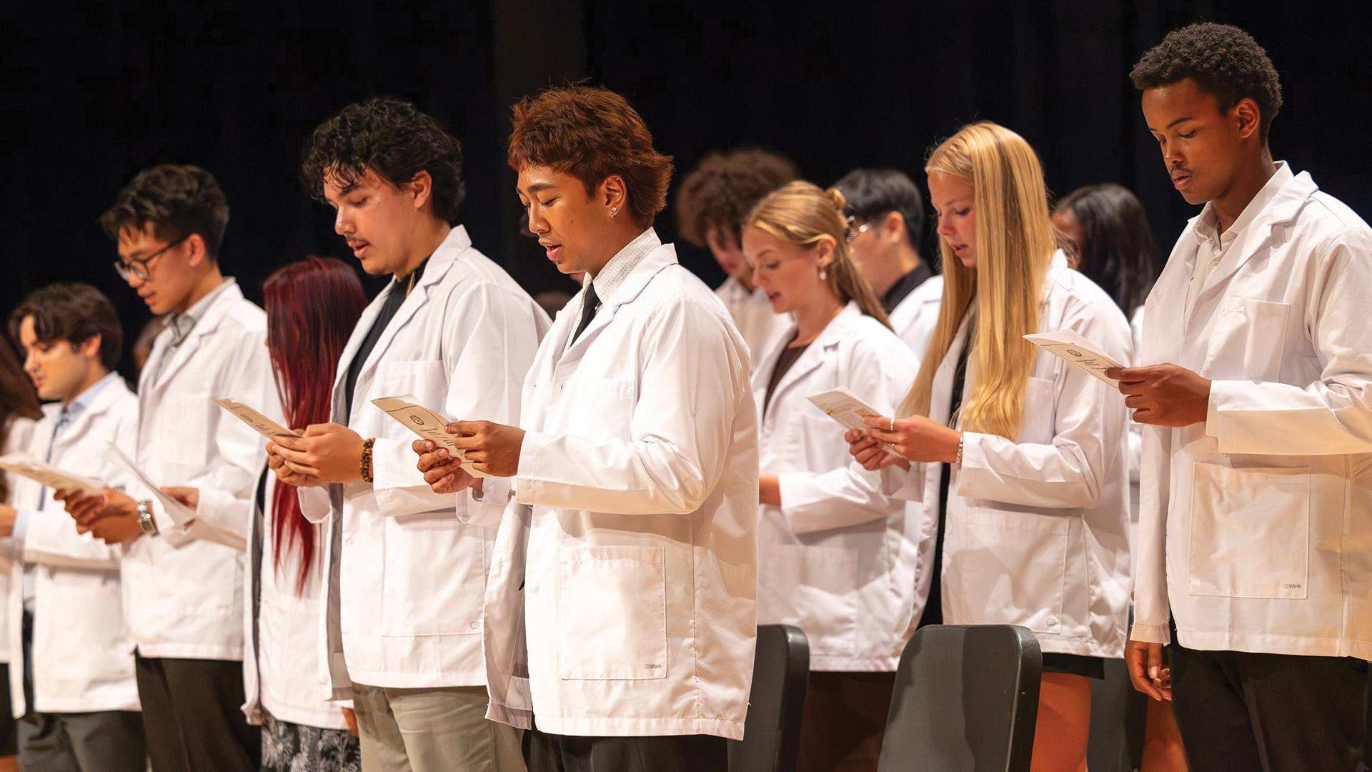 Nursing students reciting the White Coat Ceremony oath