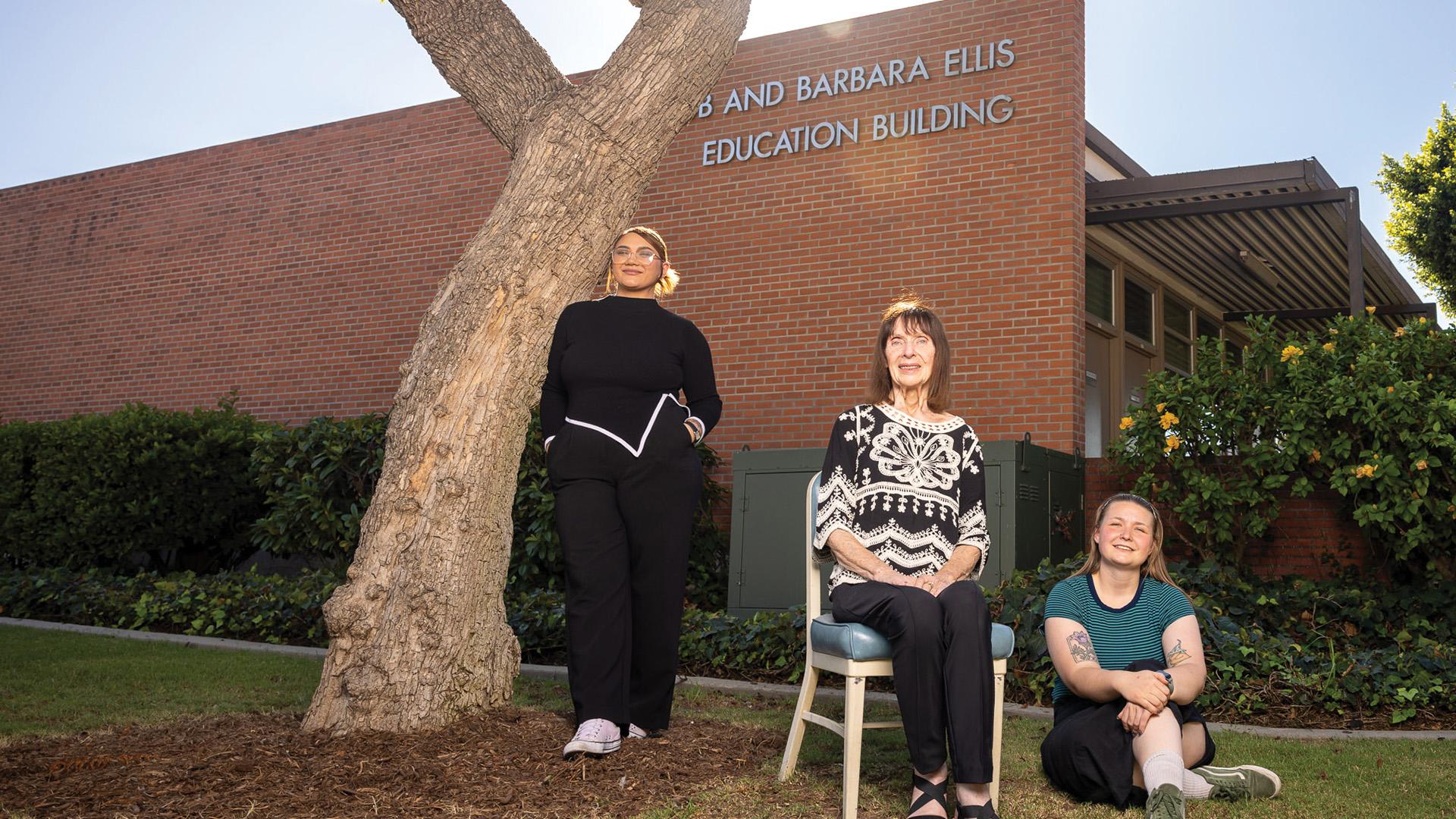 Charlotte Hamilton, Barbara Ellis and Raven Moon in front of the College of Education building
