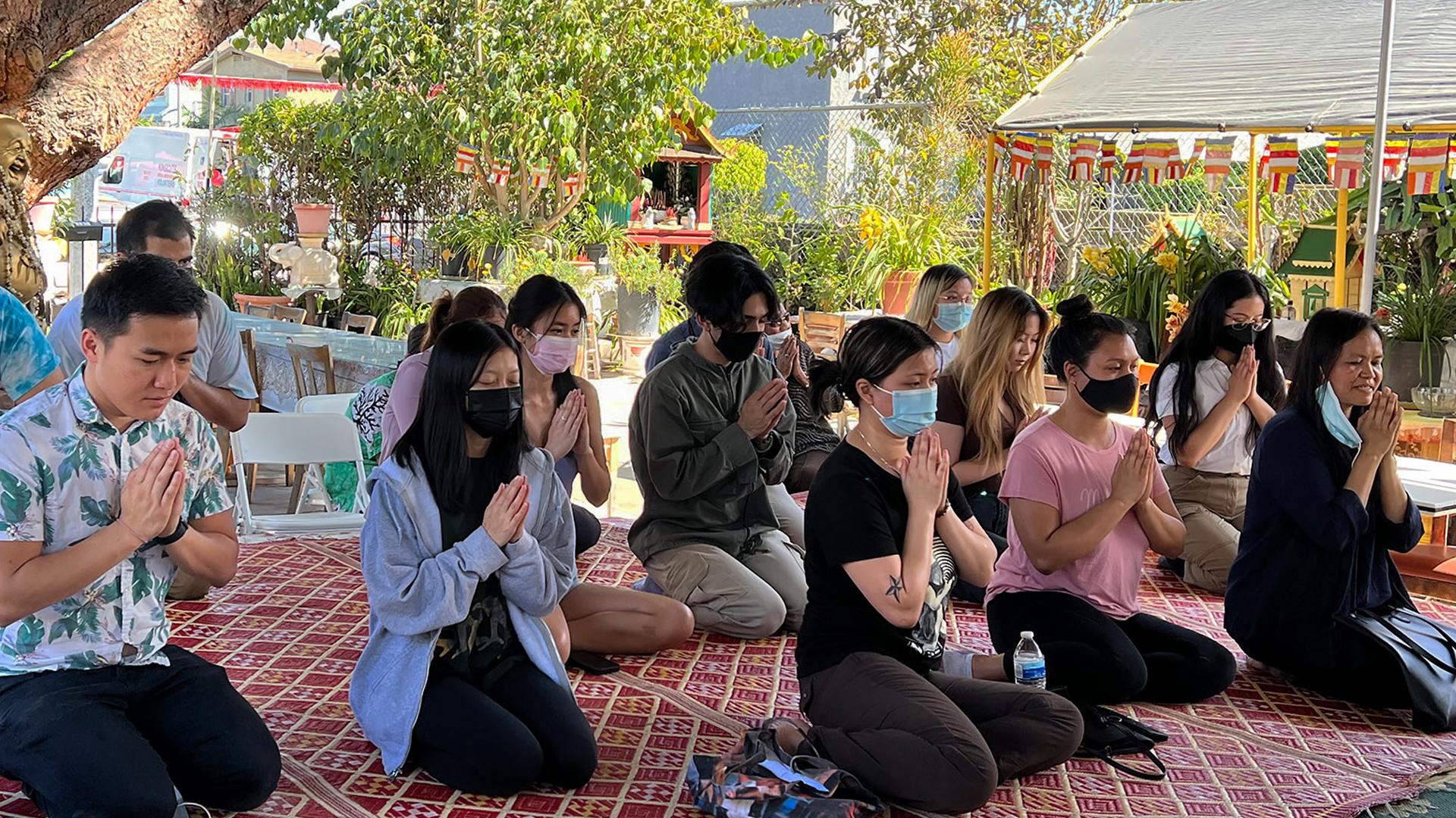 Students praying at a Garden