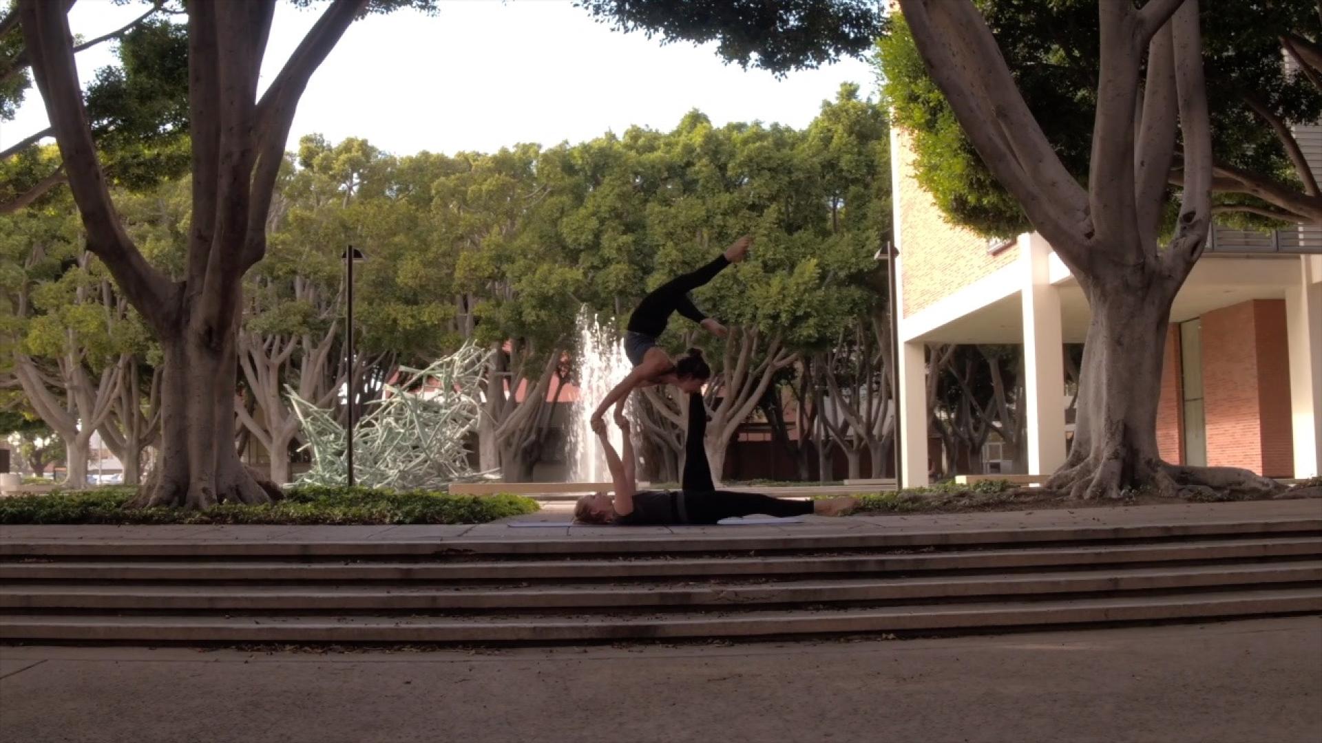 Cynthia Price hoists her acrobatics partner.