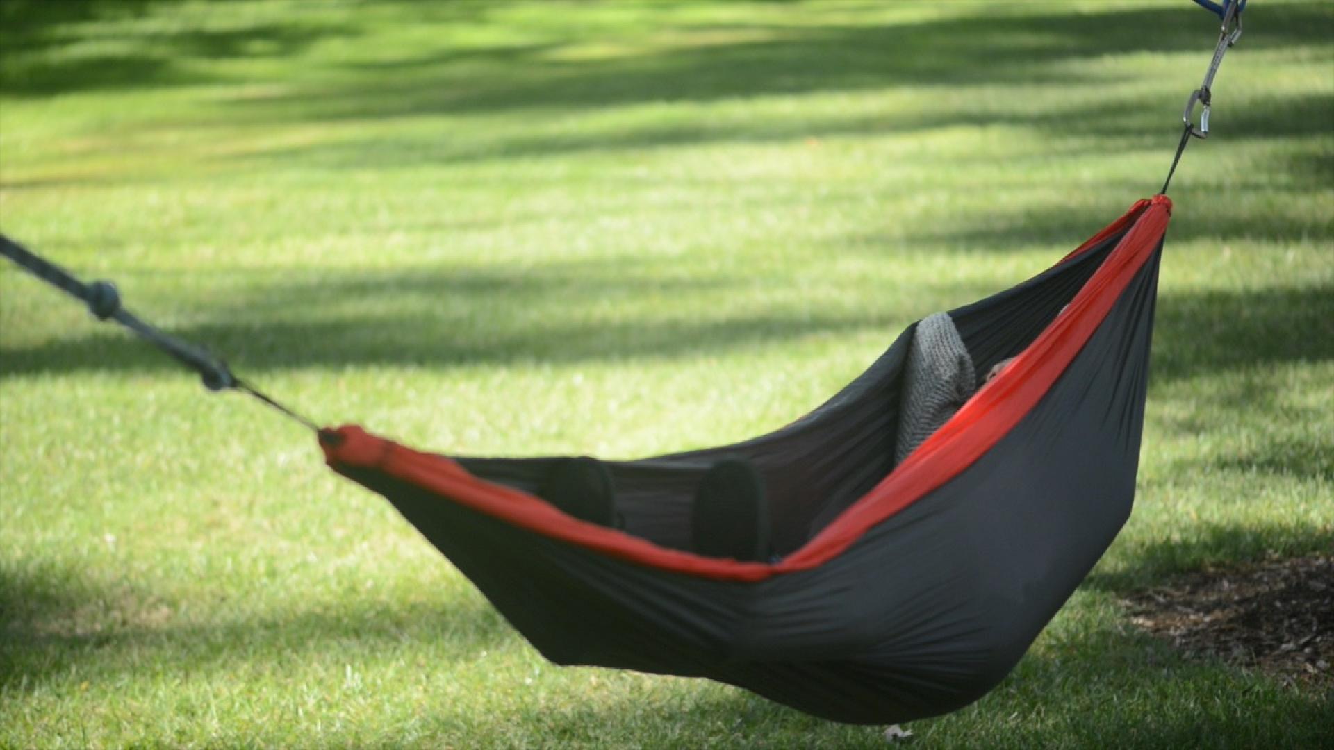 Students relaxing in hammocks during finals week.
