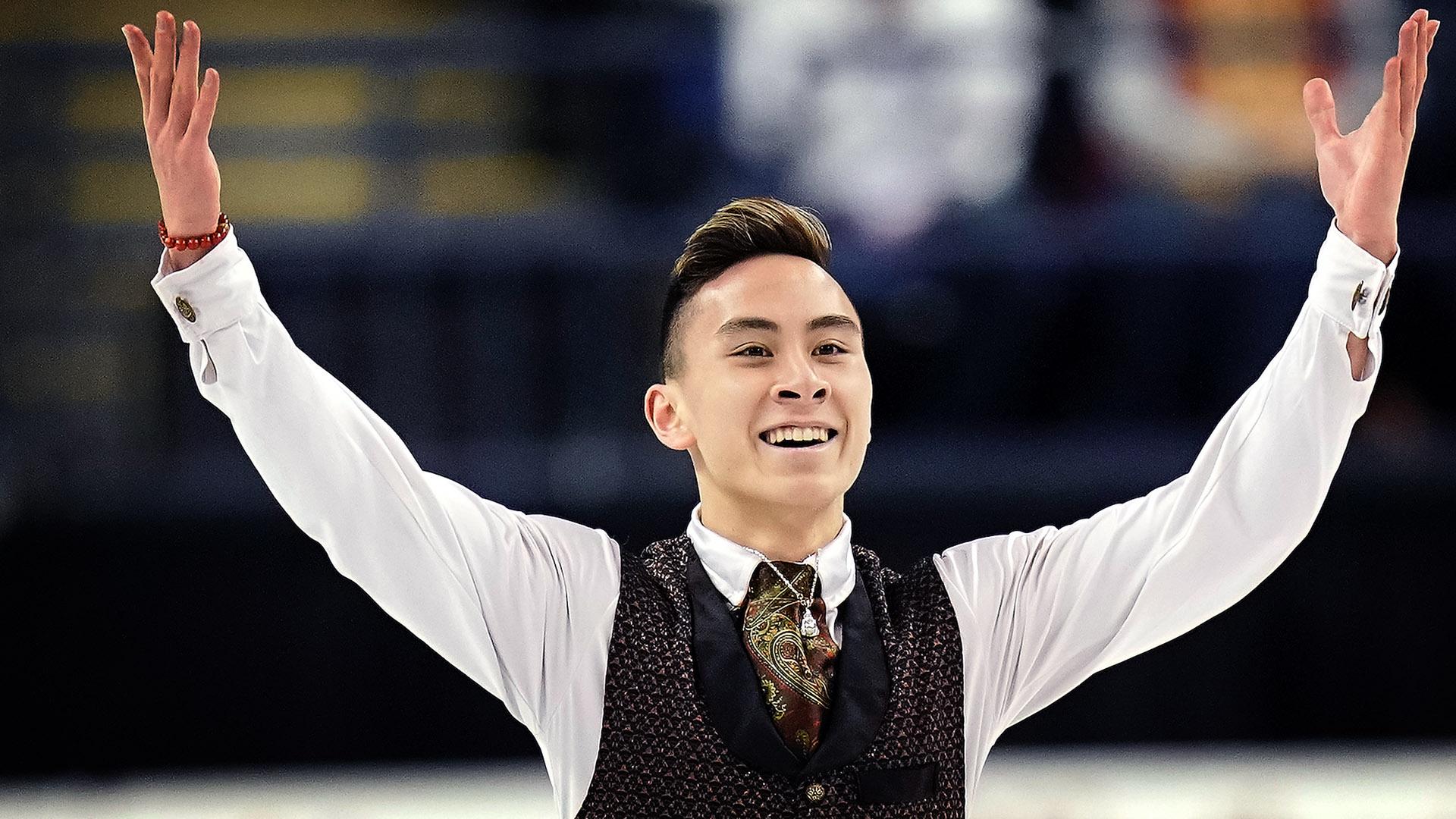 Dinh Tran raises his arms