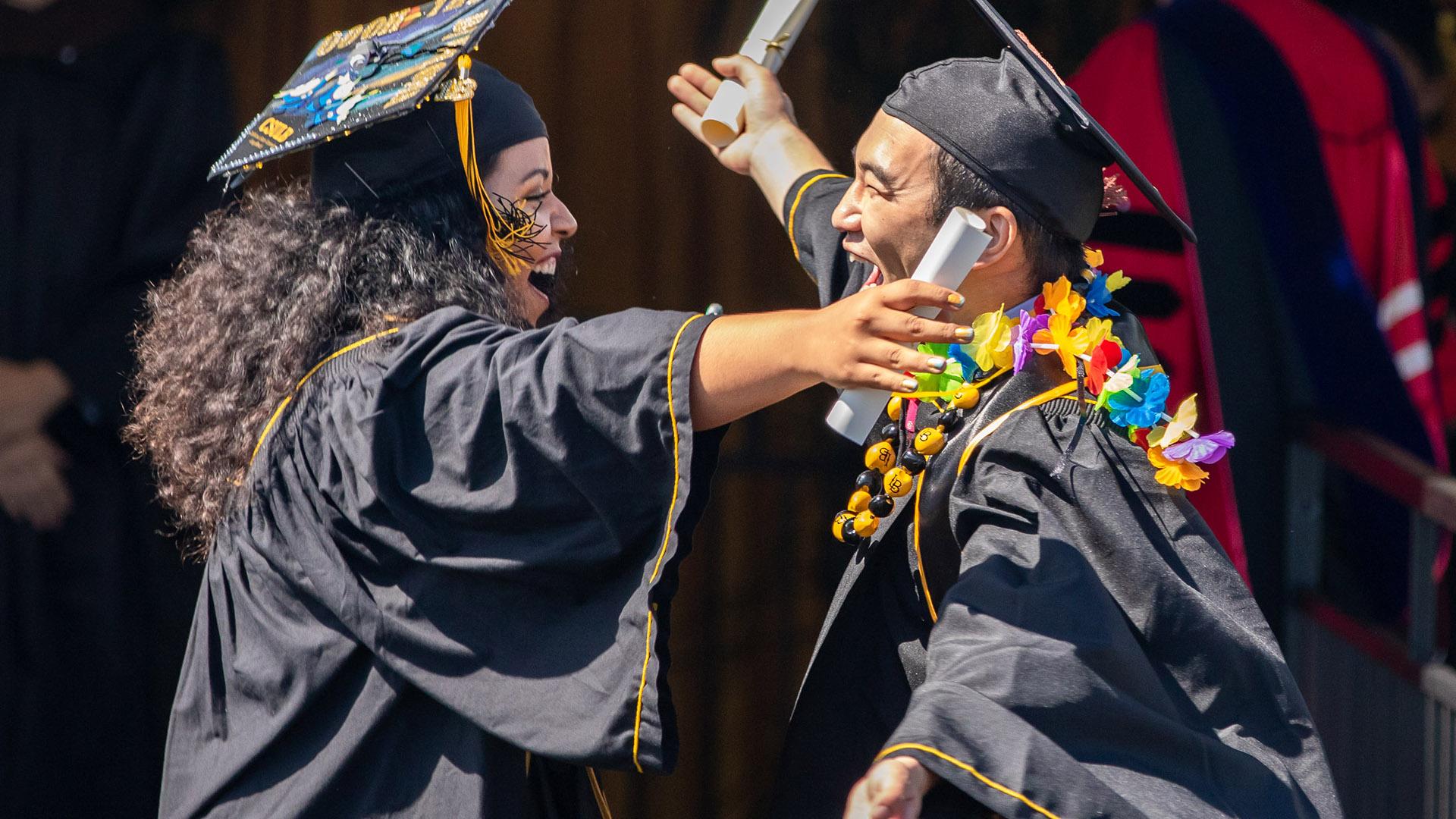 Graduates hugging