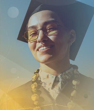 Student wearing graduation cap and lei