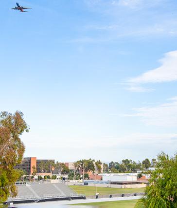 Airplane flying over campus