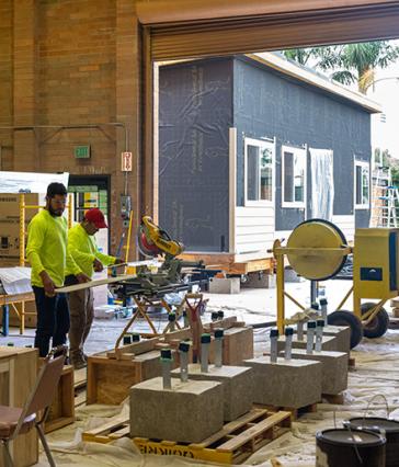 Workers building tiny house