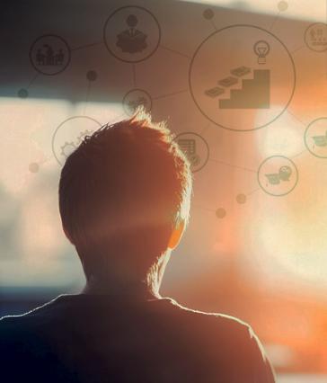 The back of a person's head superimposed over several graphics symbolizing different professions