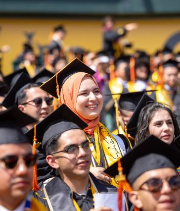 A diverse crowd of graduates at Commencement
