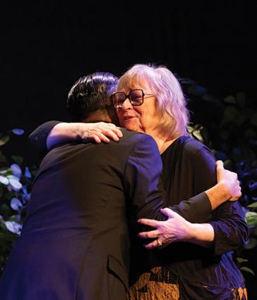Jane Close Conoley sharing an embrace
