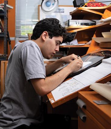CSULB animation student working on drawing