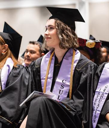 CSULB student at the Lavender graduation celebration