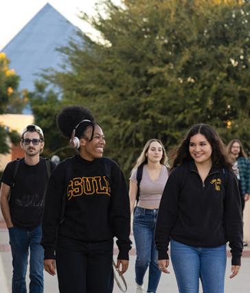 Students walking on the bridge, center of campus