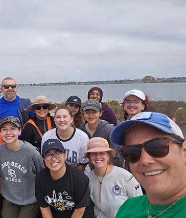 Christine Whitcraft and student researchers in the field
