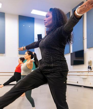 Zakiya Atkinson, right, leads a dance class at CSULB