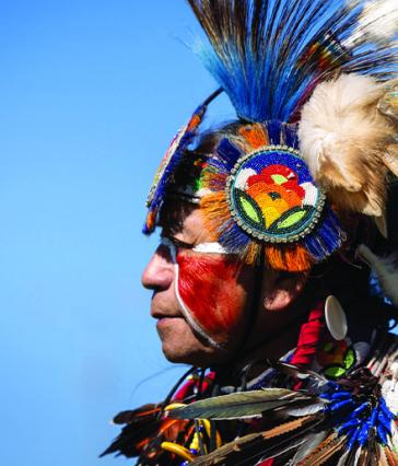 A person wearing a traditional Native American headdress