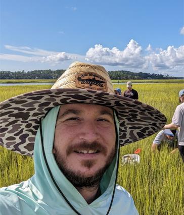 John Carroll in a field