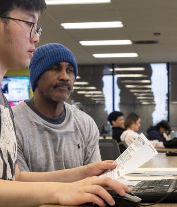 VITA site coordinator Christopher Park helping a client at CSULB