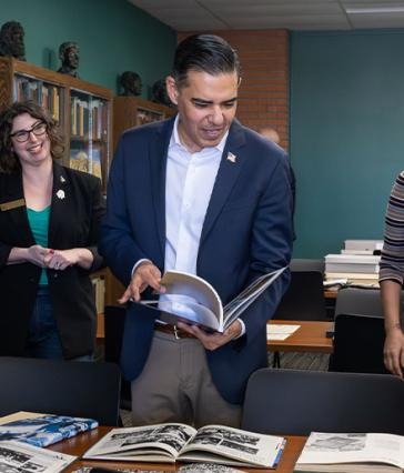 Person looks over materials in archive room