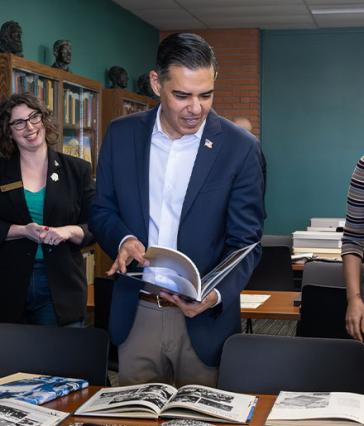 Person looks over materials in archive room