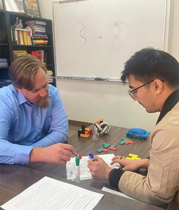 Dr. Ryan Blair and student researcher in the lab