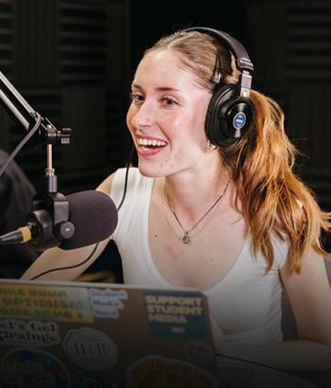 CSULB student journalist in a podcasting studio