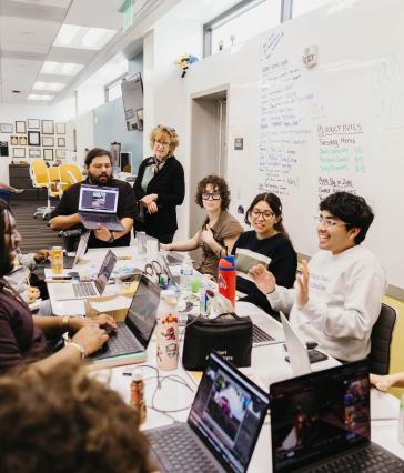 A newsroom meeting at the LB Current