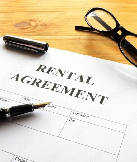 rental agreement and pen for signature