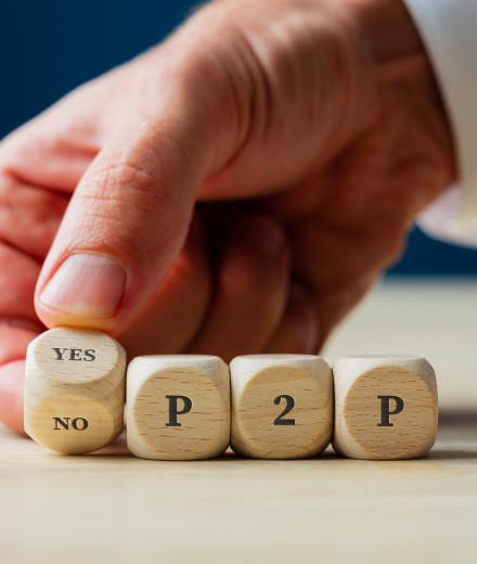 Hand  placing YES/NO Peer 2 Peer dice