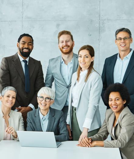 business people of different races and a pc