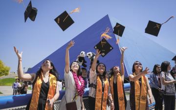 Students Throwing Grad Caps