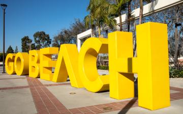 Sunny Go Beach sign