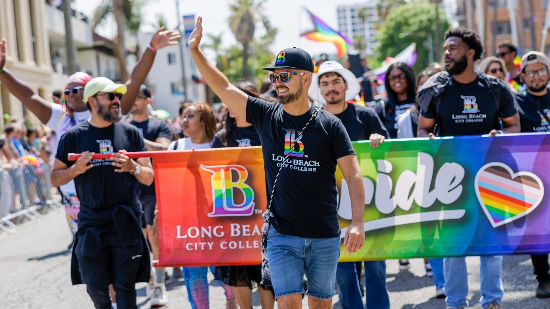 Mike Muñoz, center, marches at a Long Beach Pride Parade