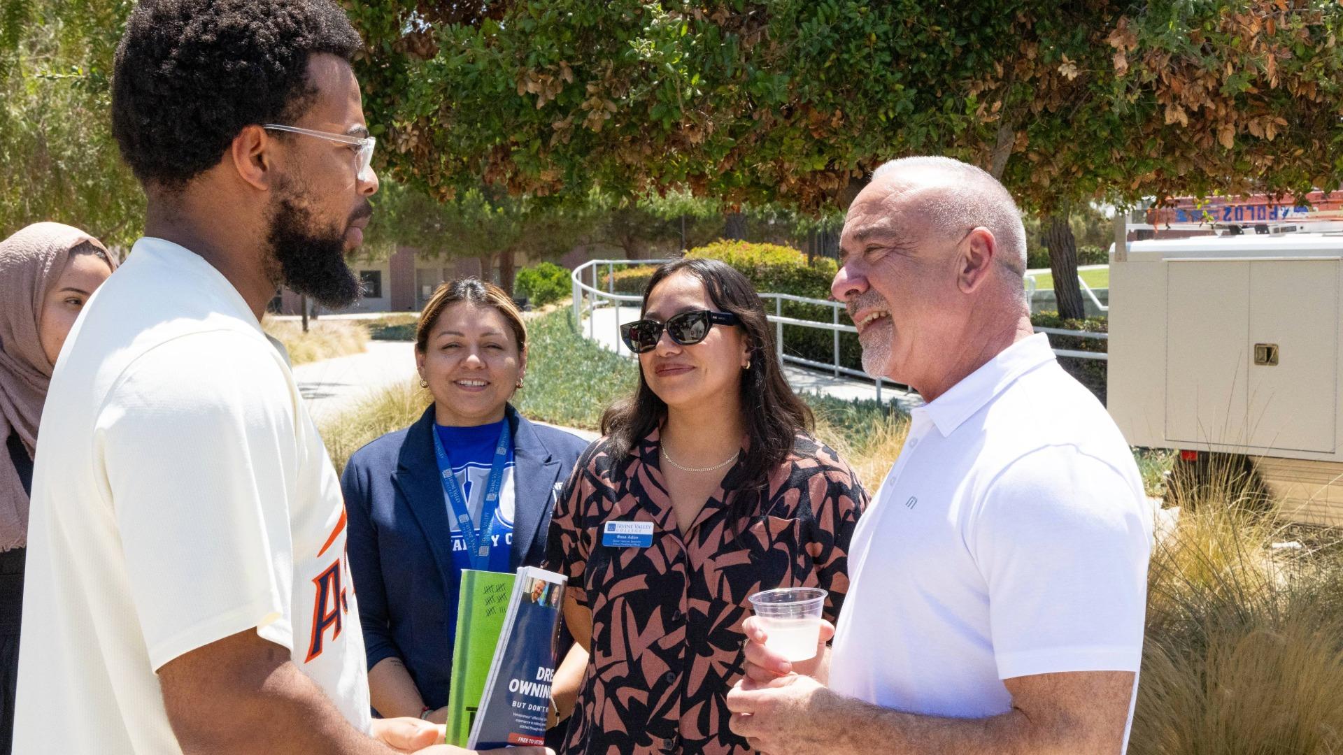 John Hernandez speaks to a student at Irvine Valley College
