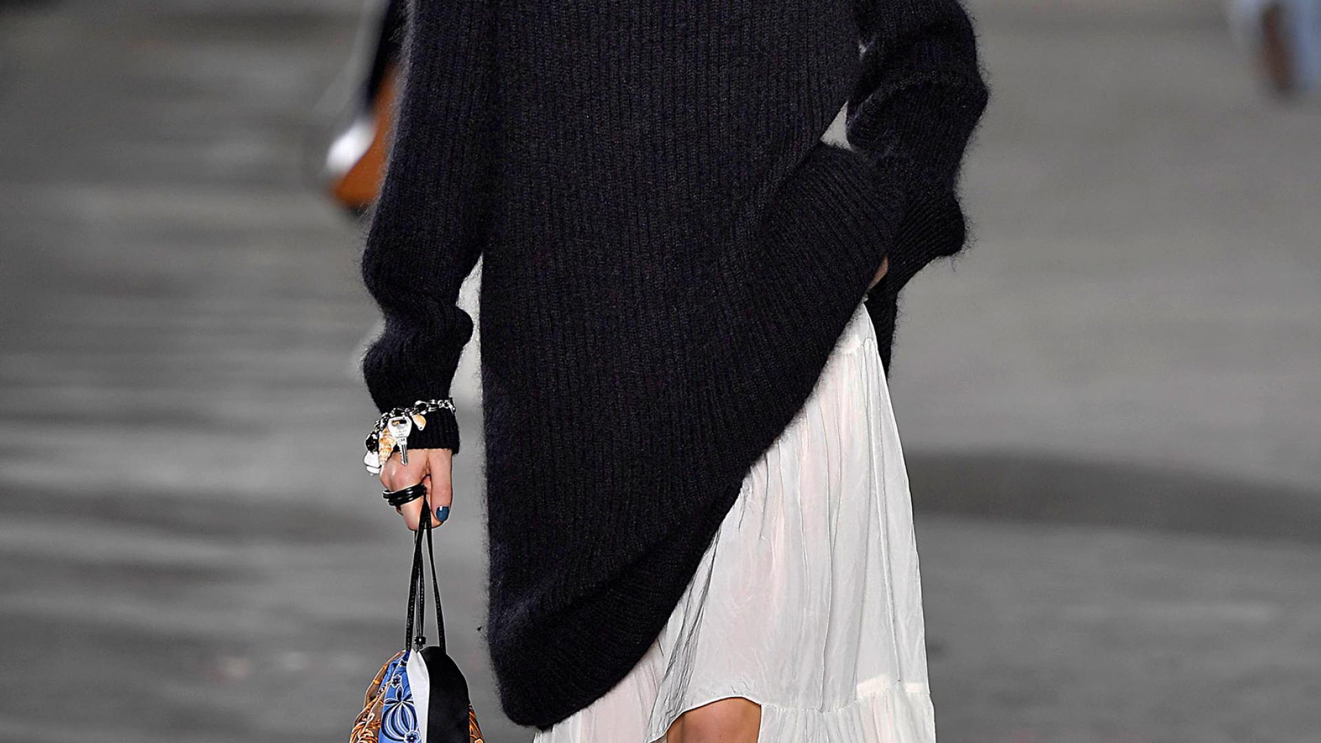 Phillip Lim's collections feature many cool-girl looks, such as this draped black sweater over a ruffled skirt.