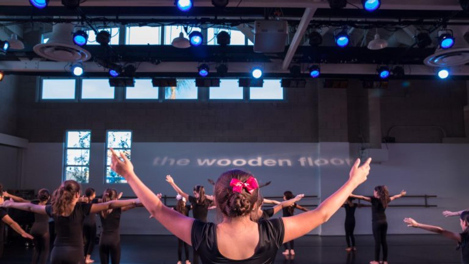 Dancers holding their hands in the air
