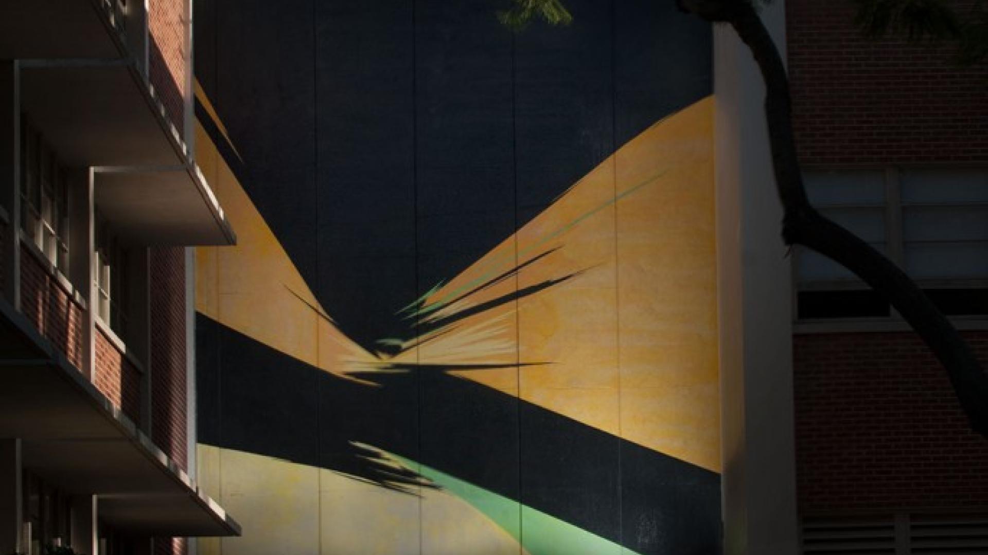 Rita Letendre, Sun Forces (mural);  Epoxy paint on concrete 264 x 252 inches.  “I want people walking in and out of my painting…it must be dynamic with action and an interaction that continues in the mind of the spectator,” said Letendre. This piece is of historical importance to the North American mural movement, as outdoor wall paintings were rare at the time of the 1965 university symposium