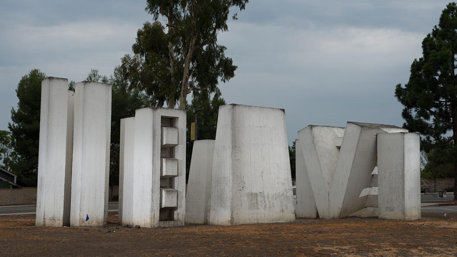 J.J. Beljon, Homage to Simon Rodia;  Cast concrete and paint 153 x 296 x 1,582 inches.  Beljon dedicated this piece in memory of the creator of Los Angeles’ Watts Towers, saying “Rodia, an Italian immigrant, built the towers as a way of saying ‘thank you’ to this country. I, too am grateful to America for her great ideas and with my work in this symposium say ‘thank you,’ too