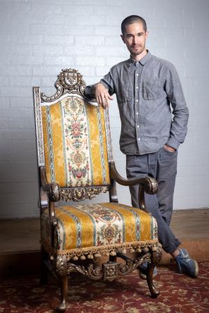 Brian Valenzuela Brian Valenzuela stands next to a chair