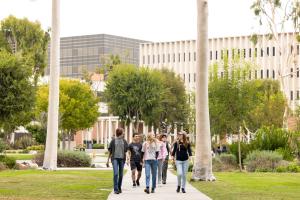 Giving Tuesday Banner students walking on campus