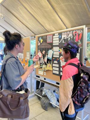 students looking at poster projects