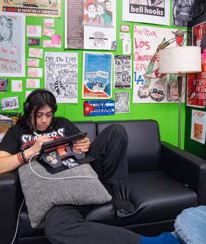 Student studying inside the Latinx Resource Center Student studying inside the Latinx Resource Center