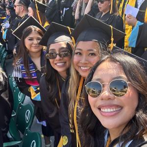 College of Ed graduates pose at commencement